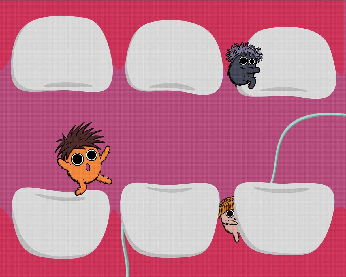 Dental floss slides between two teeth.